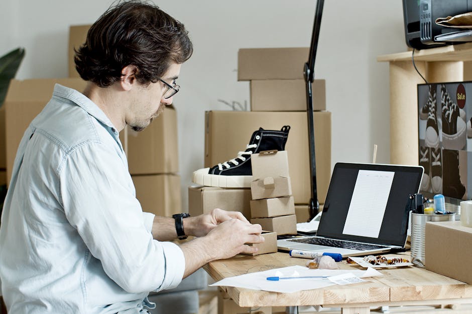 person using laptop with order history and refund records on